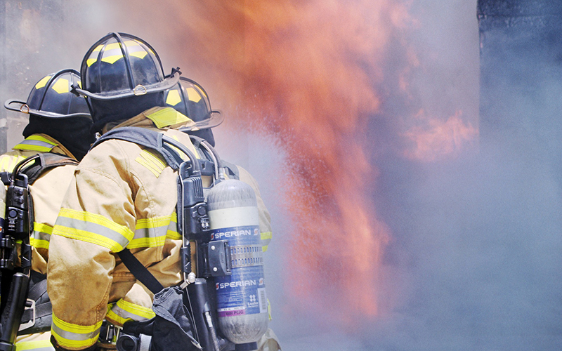 Stock image of firefighters in a disaster scenario