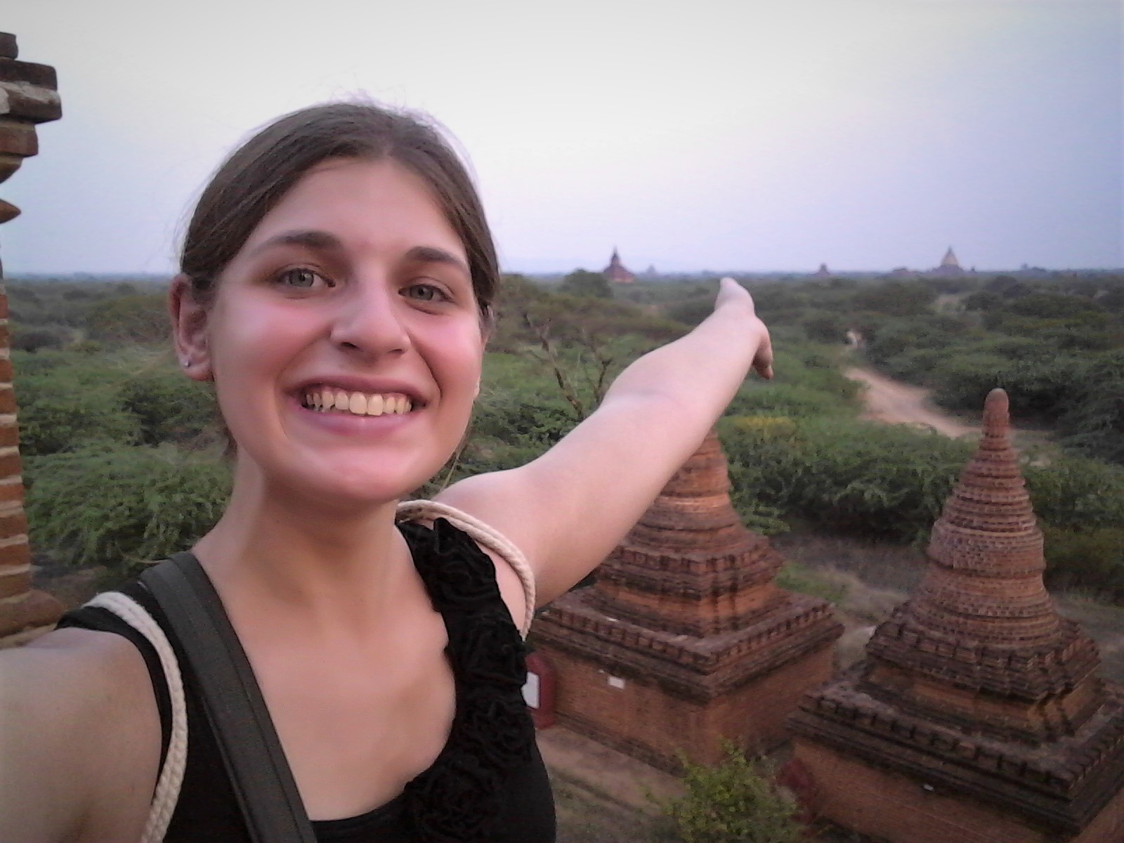 Study abroad student poses in front of a landscape while on travel during study abroad in Singapore.