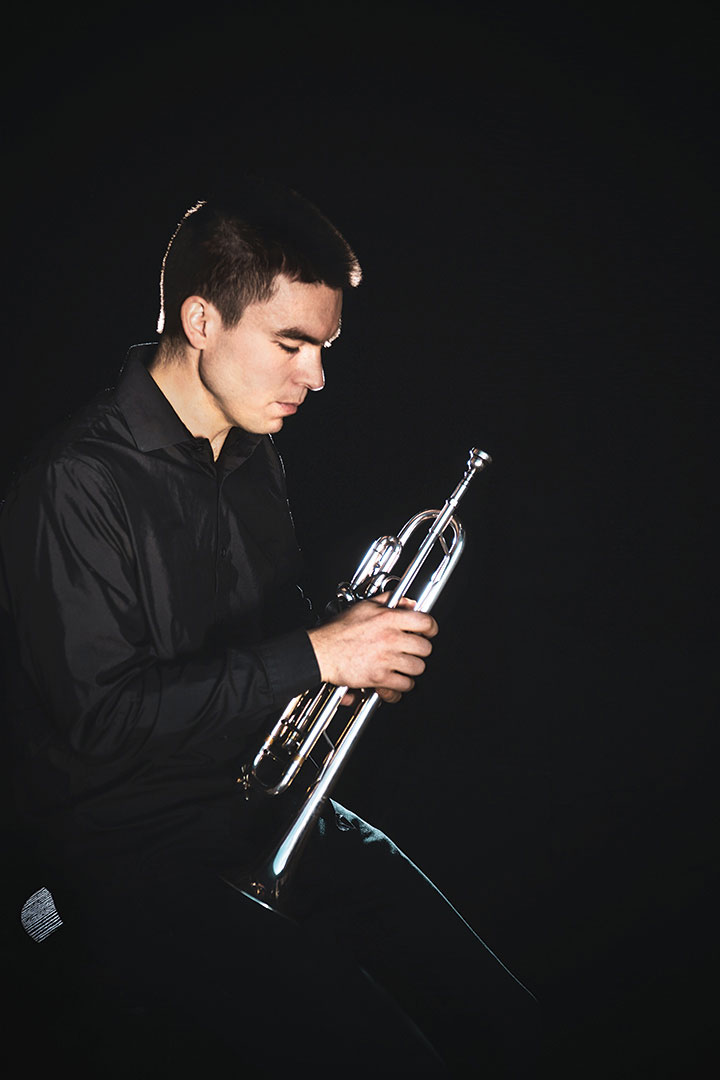 Student holds trumpet