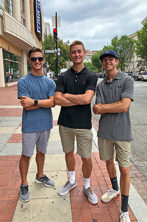 A photo of three male engineering students on campus