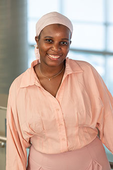 headshot of Iman-Louise Mwai