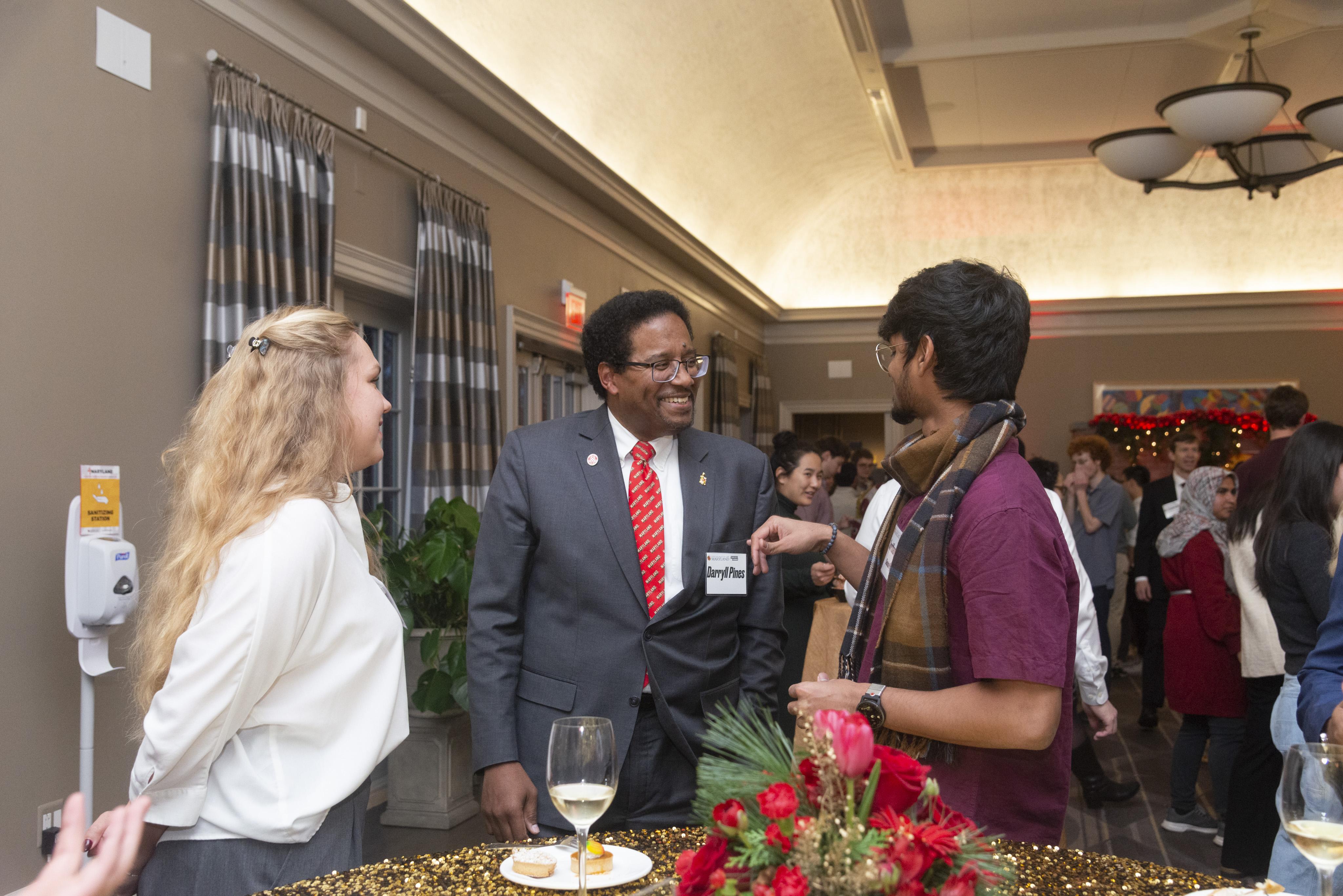 Students talking with President Pines