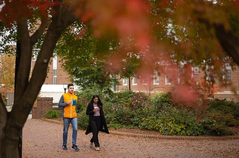 Two people walking outdoors