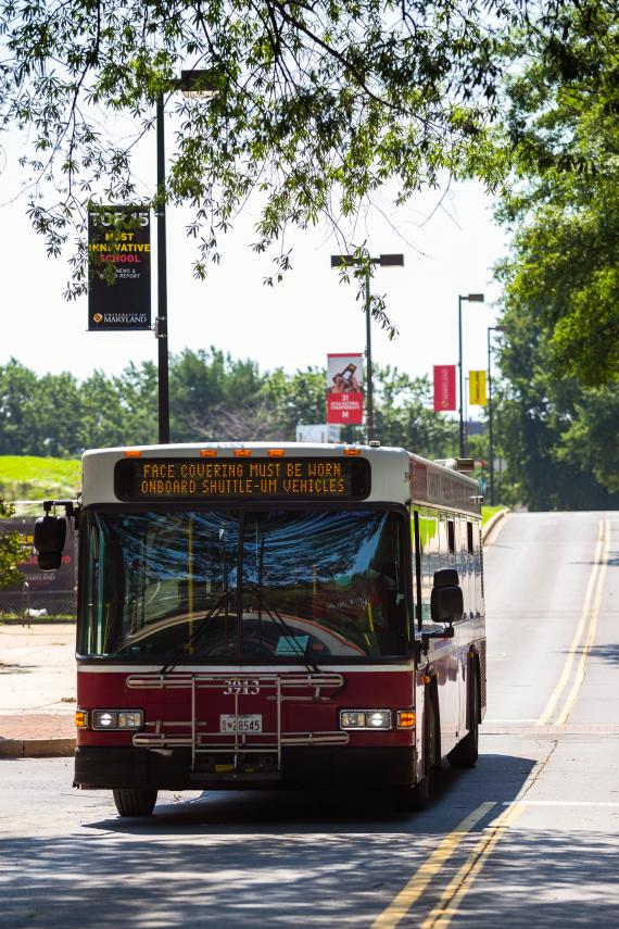 umd shuttle bus faced front driving on the road